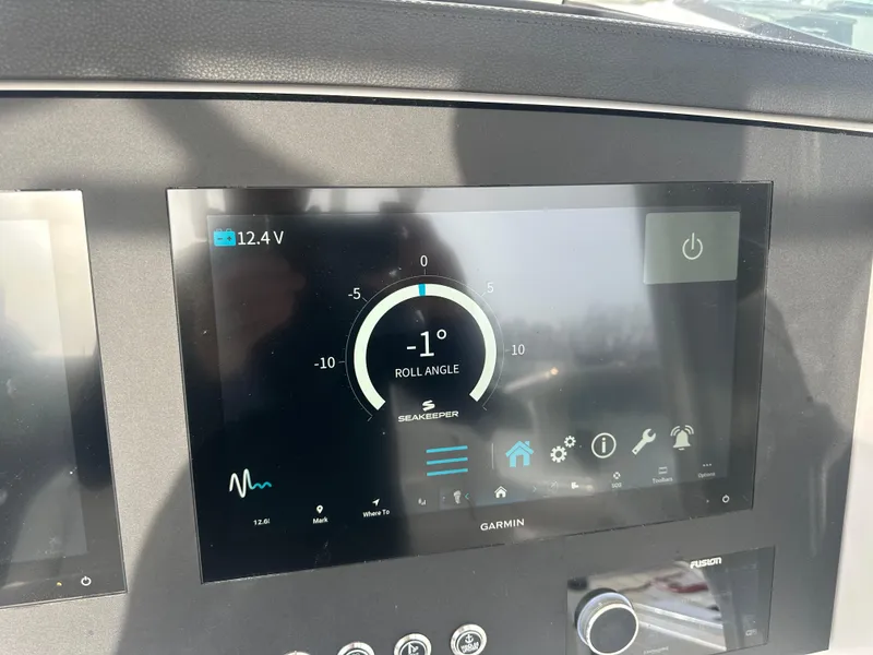 Slide: The Image of Garmin display on 2024 Regulator 31 boat showing roll angle and system status. - 20