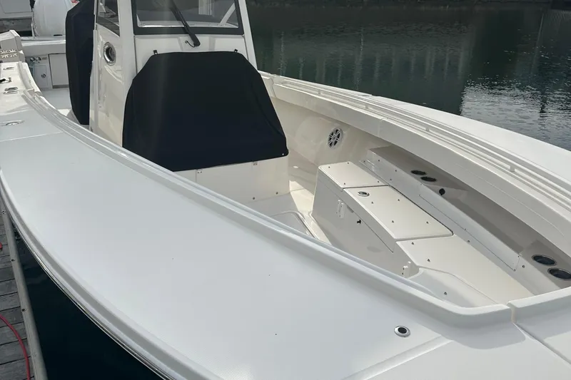 Slide: The Image of 2024 Regulator 31 boat with sleek white deck and modern design. - 9