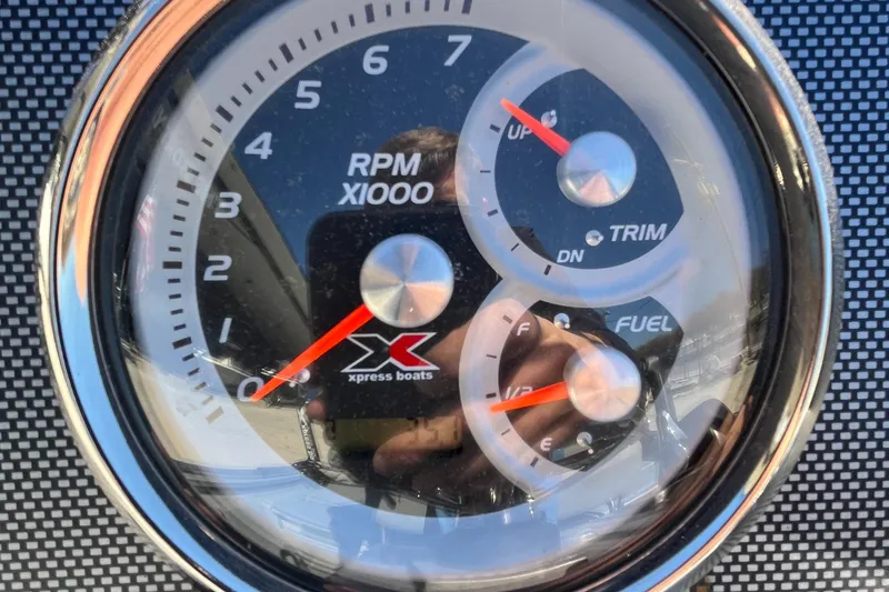 Slide: The Image of Tachometer and gauges on 2022 Xpress H20B Bay Boat dashboard. - 15
