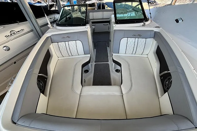 Slide: The Image of 2016 Sea Ray 220 Sundeck Outboard interior with spacious seating and elegant design. - 10
