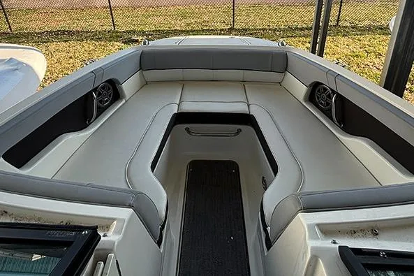 Slide: The Image of 2016 Sea Ray 220 Sundeck Outboard interior with spacious seating and modern design. - 12