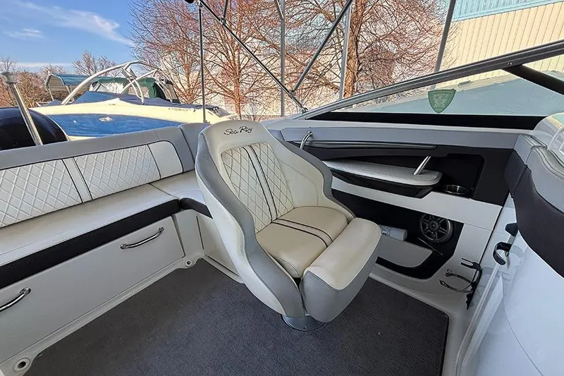 Slide: The Image of 2016 Sea Ray 220 Sundeck Outboard interior with luxurious seating and modern design. - 14