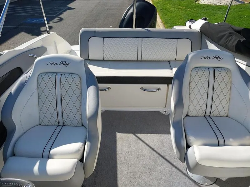 Slide: The Image of 2016 Sea Ray 220 Sundeck Outboard interior with luxurious seating and elegant design. - 3