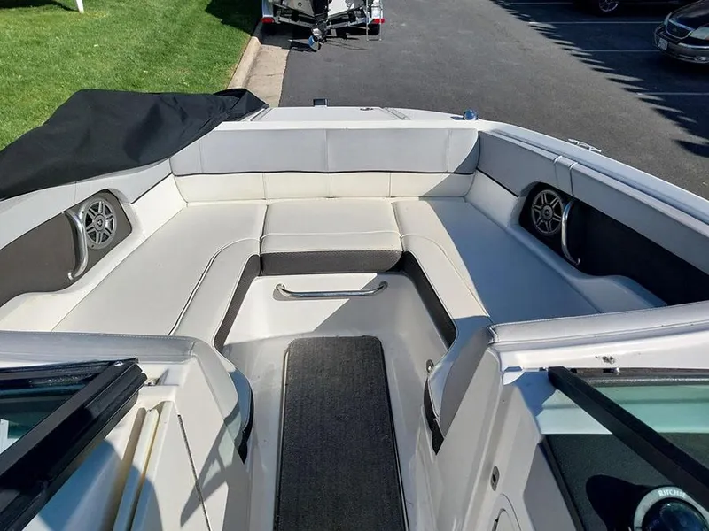 Slide: The Image of 2016 Sea Ray 220 Sundeck Outboard boat interior with spacious seating and modern design. - 5