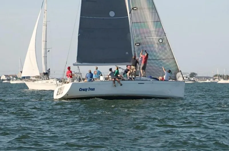 Slide: The Image of Sailing yacht "Crazy Ivan," Beneteau First 36.7, 2006, on open water with crew. - 0