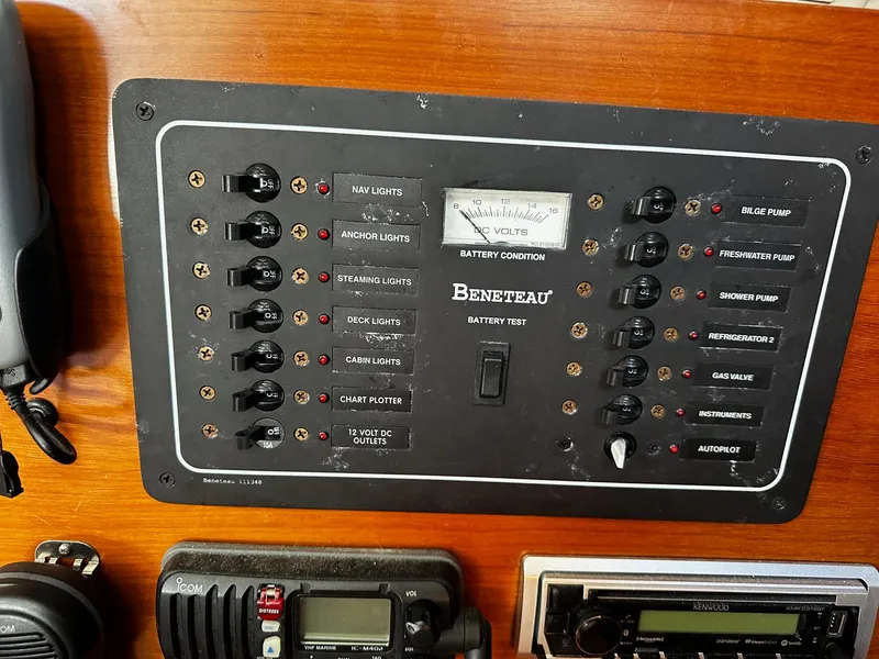 Slide: The Image of Electrical control panel on a 2006 Beneteau First 36.7 sailboat, featuring various switches and gauges. - 16