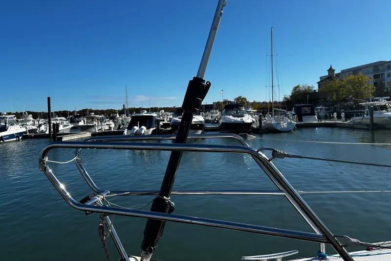 Slide: The Image of Beneteau First 36.7 sailboat docked in a marina, 2006 model, with clear blue sky. - 27