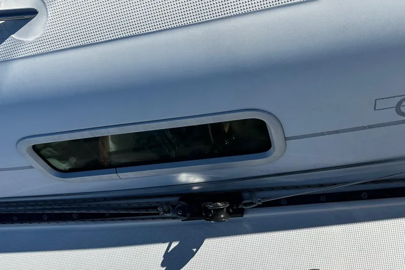 Slide: The Image of Close-up of a 2006 Beneteau First 36.7 yacht window and deck detail. - 31