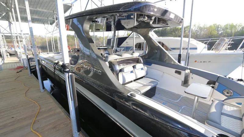 Slide: The Image of 2017 Mystic Powerboats M4200 docked, showcasing sleek design and modern features. - 17