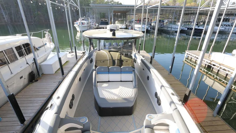 Slide: The Image of 2017 Mystic Powerboats M4200 docked, showcasing spacious seating and sleek design. - 19