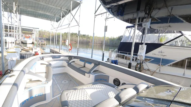 Slide: The Image of 2017 Mystic Powerboats M4200 docked, showcasing spacious seating and elegant design. - 21