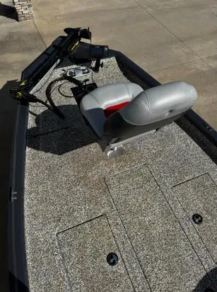 Slide: The Image of 2015 Tracker Pro Team 190 TX boat with gray seating and fishing equipment. - 4