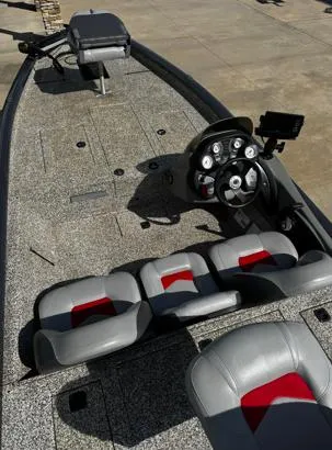 Slide: The Image of 2015 Tracker Pro Team 190 TX boat interior with steering console and seating. - 5