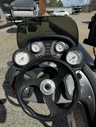 Slide: The Image of 2015 Tracker Pro Team 190 TX dashboard with steering wheel and gauges. - 7