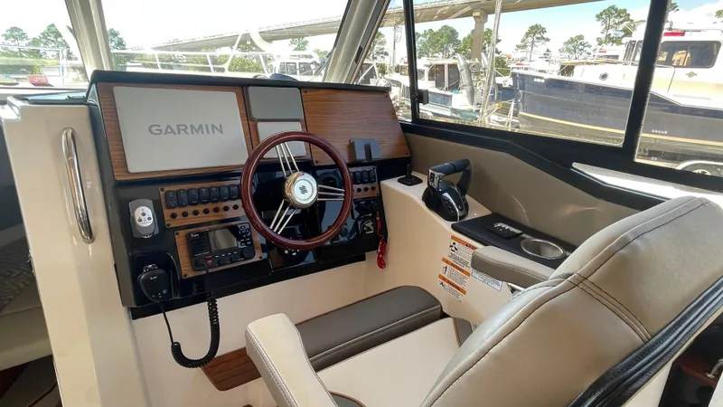 Slide: The Image of 2023 Cutwater C-288 helm with Garmin navigation system and modern controls. - 11