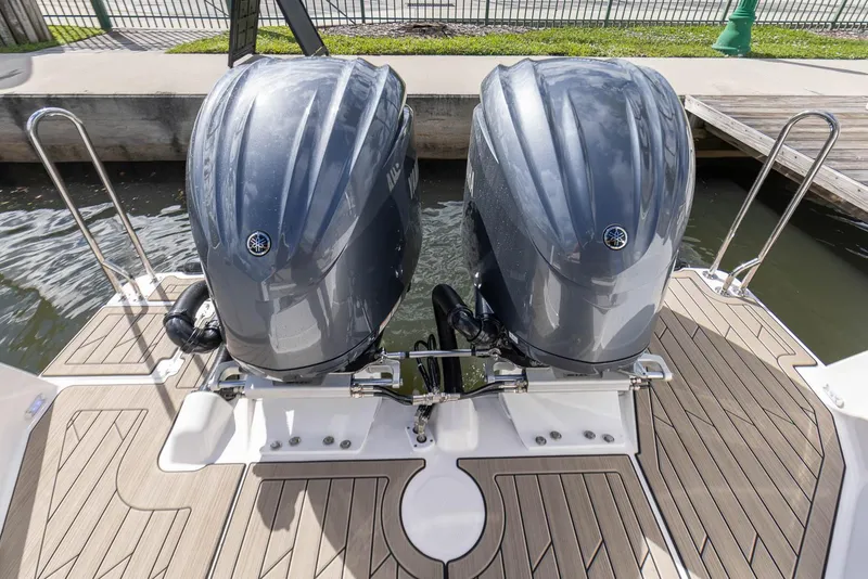Slide: The Image of 2023 Cutwater C-288 boat with dual outboard engines on a wooden deck. - 8