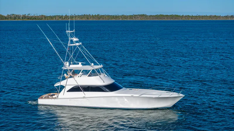 The Image of A 2004 Viking 2005 model yacht cruising on clear blue waters under a sunny sky. - 0