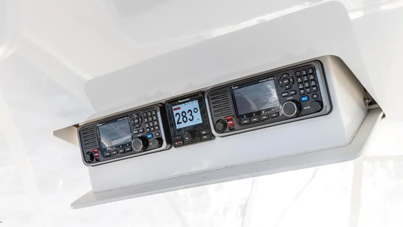 Slide: The Image of Control panel of a 2004 Viking 2005 boat, featuring navigation and communication equipment. - 17