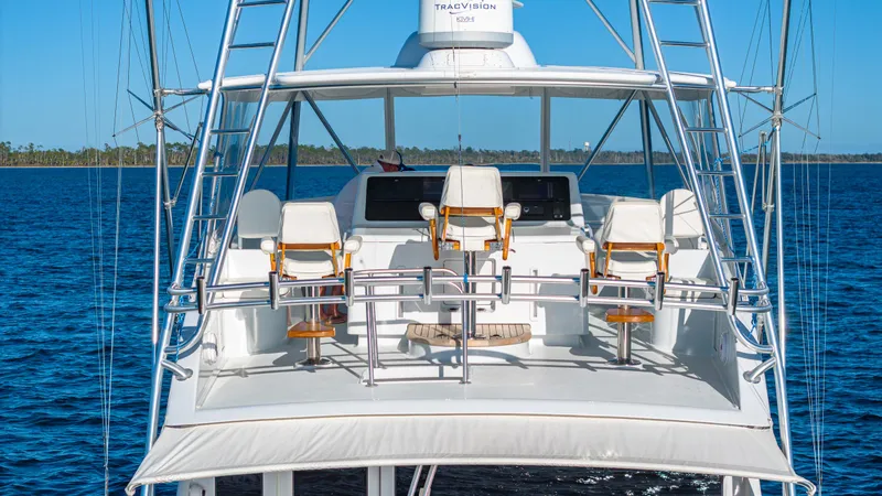 Slide: The Image of Luxury Viking 2005 yacht bridge with seating, ocean backdrop, clear blue sky. - 25