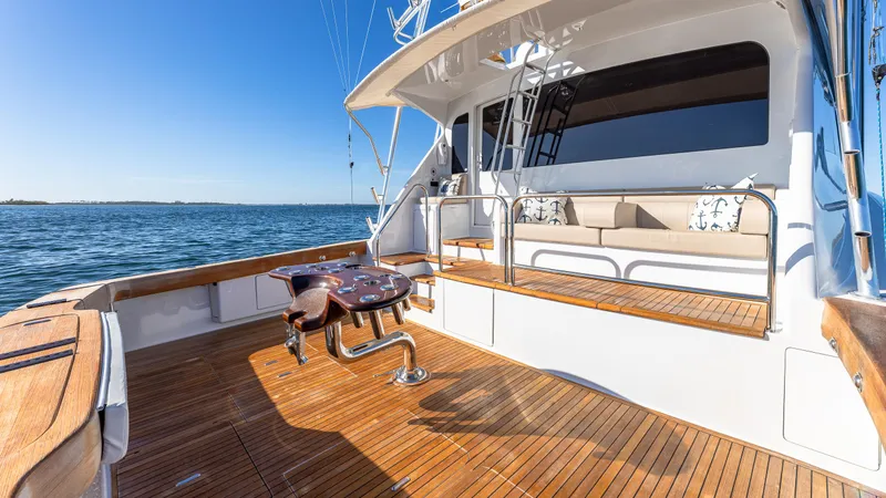 Slide: The Image of Luxury Viking 2005 yacht deck with wooden flooring, ocean view, and seating area. - 30