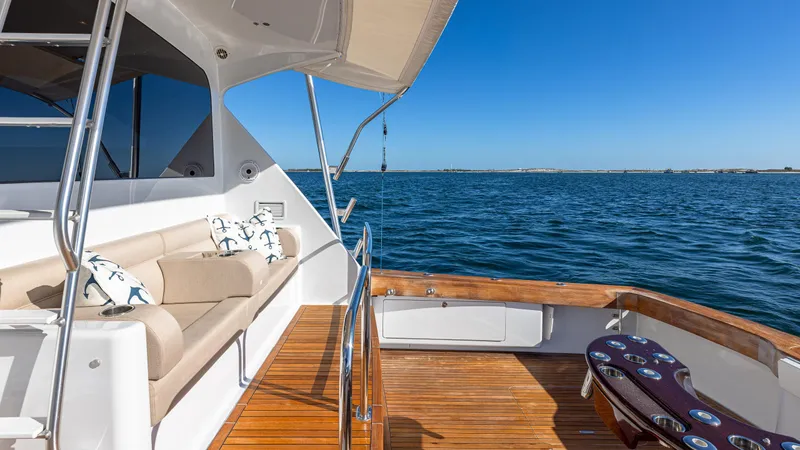 Slide: The Image of Luxurious 2004 Viking yacht deck with seating, overlooking calm blue waters. - 34