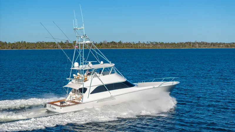 Slide: The Image of Luxury Viking 2005 yacht cruising on blue water, clear sky, 2004 model. - 4