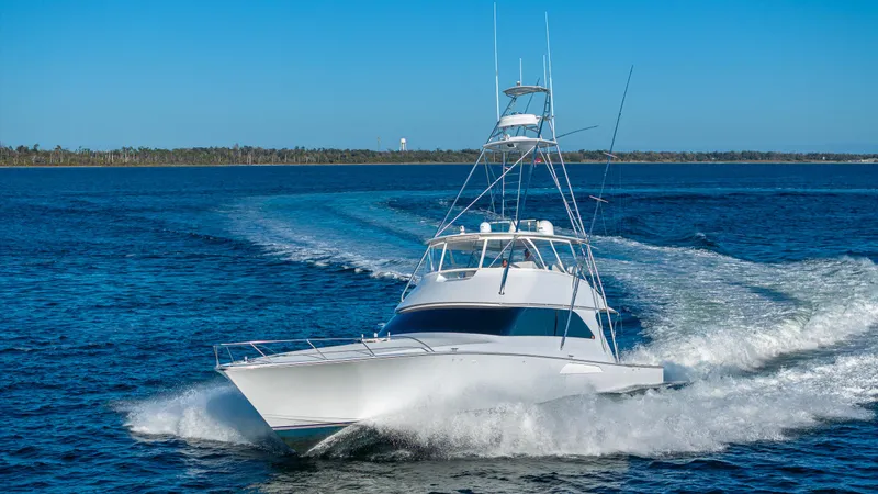 Slide: The Image of Viking 2005 yacht cruising on open water, 2004 model, clear blue sky. - 8