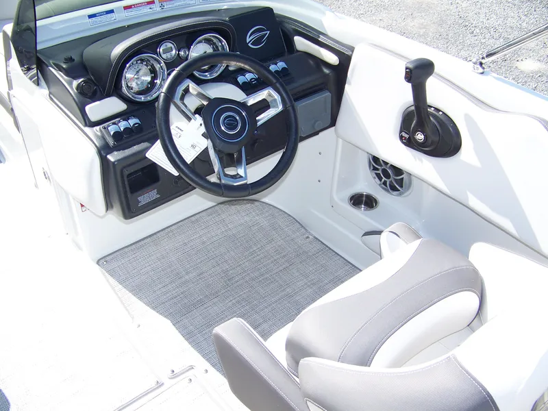 Slide: The Image of 2026 Crownline Eclipse E210 XS boat cockpit with modern steering and controls. - 10