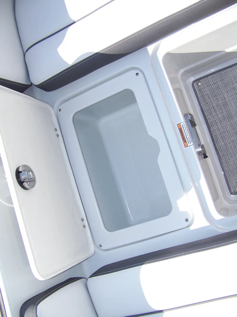 Slide: The Image of Storage compartment in 2026 Crownline Eclipse E210 XS boat, featuring sleek design and ample space. - 13