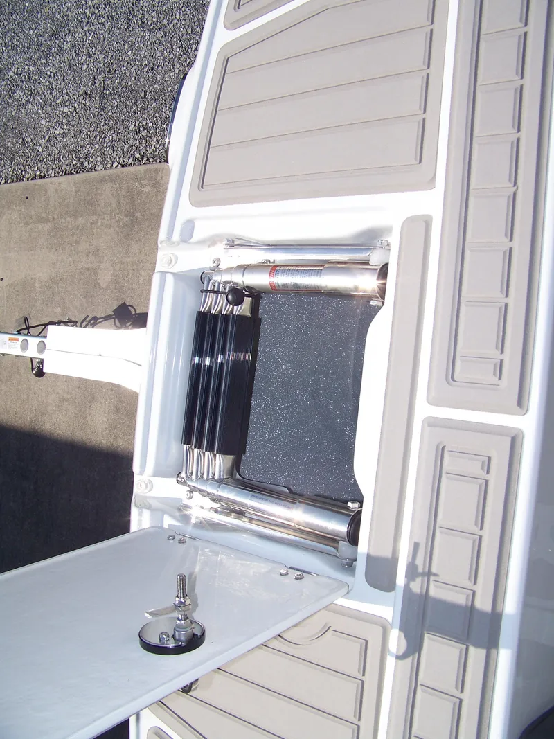 Slide: The Image of 2026 Crownline Eclipse E210 XS boat swim platform with ladder. - 14