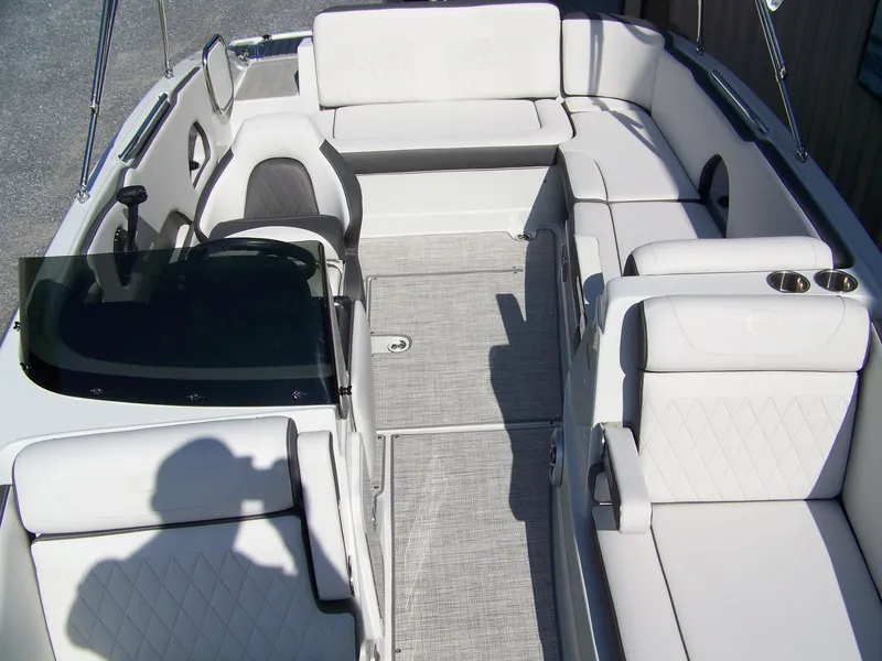 Slide: The Image of 2026 Crownline Eclipse E210 XS boat interior with white seating and modern design. - 18
