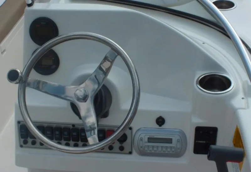 Slide: The Image of Steering console of 2025 Key West 203 DFS boat with controls and gauges. - 4