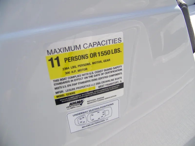 Slide: The Image of Capacity label on 2026 Crownline Eclipse E230 XS boat, max 11 persons or 1550 lbs. - 11