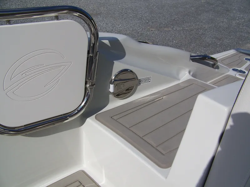 Slide: The Image of 2026 Crownline Eclipse E230 XS boat interior detail with sleek design and logo. - 17