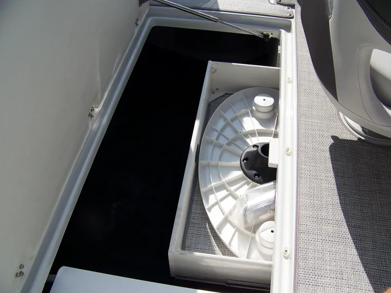 Slide: The Image of Storage compartment in 2026 Crownline Eclipse E230 XS boat, featuring organized interior space. - 18