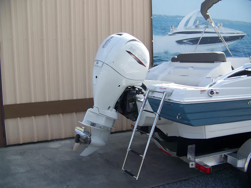 Slide: The Image of 2026 Crownline Eclipse E230 XS boat with Mercury outboard motor and ladder. - 3