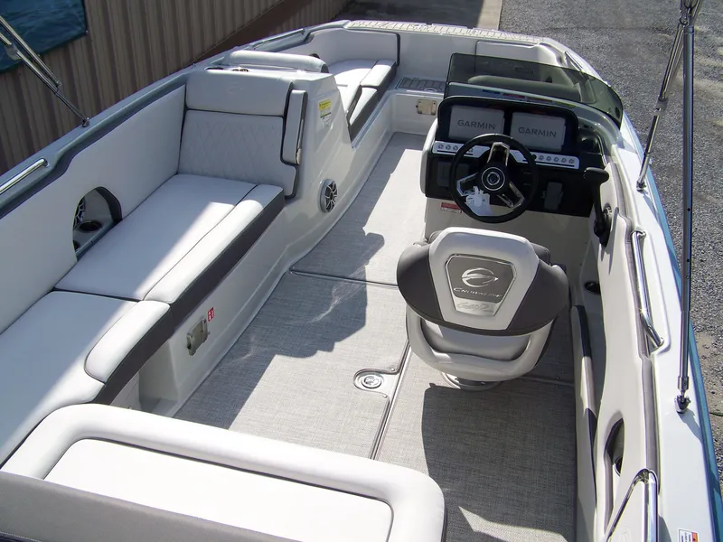 Slide: The Image of 2026 Crownline Eclipse E230 XS boat interior with seating and helm. - 5