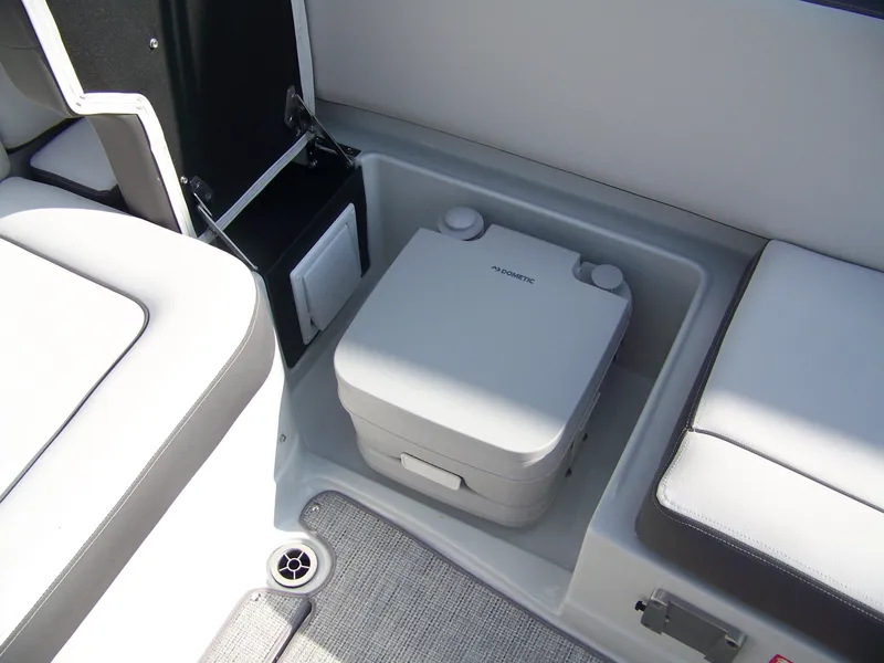 Slide: The Image of 2026 Crownline Eclipse E230 XS boat interior with portable toilet. - 8