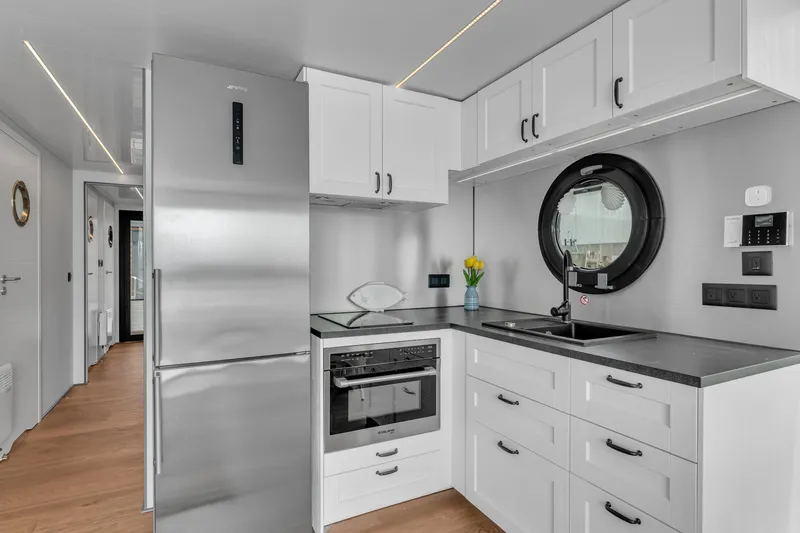Slide: The Image of Modern kitchen in 2025 Waterlodge Apart EL, featuring sleek appliances and stylish cabinetry. - 15
