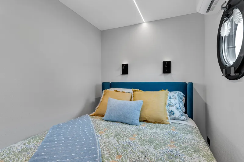 Slide: The Image of Cozy bedroom in 2025 Waterlodge Apart EL with modern decor and colorful bedding. - 18