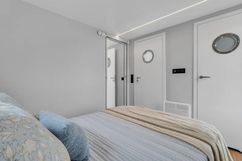 Slide: The Image of Modern bedroom interior in Waterlodge Apart EL 2025, featuring cozy bedding and sleek design elements. - 23