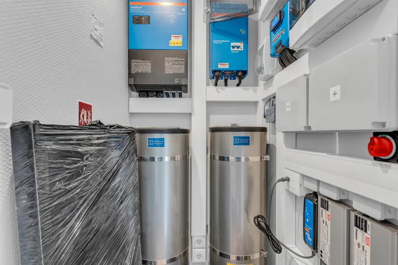 Slide: The Image of Electrical and water systems inside a 2025 Waterlodge Apart EL houseboat. - 24