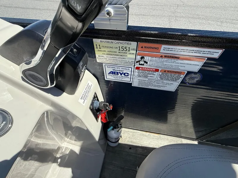 Slide: The Image of Pontoon boat controls and warning labels, Crest Classic LX Fish 220 SF, 2020 model. - 18