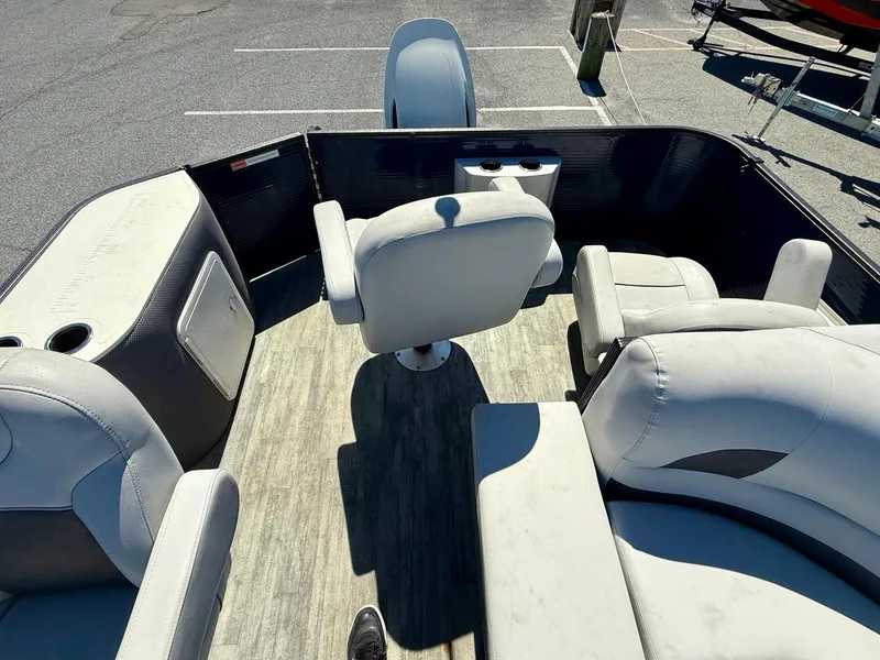 Slide: The Image of 2020 Crest Classic LX Fish 220 SF pontoon boat interior with seating and helm. - 6