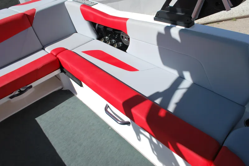 Slide: The Image of 2022 MasterCraft NXT24 boat interior with red and gray seating. - 10