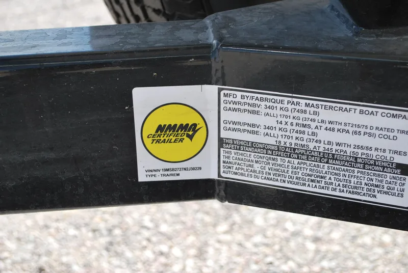 Slide: The Image of 2022 MasterCraft NXT24 trailer label with NMMA certification and weight specifications. - 20