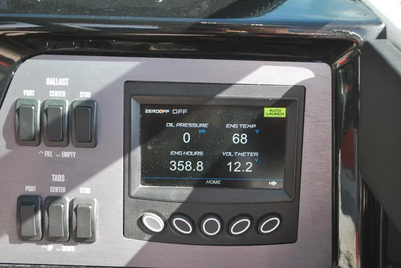 Slide: The Image of Control panel of a 2022 MasterCraft NXT24 boat displaying engine metrics and ballast controls. - 7
