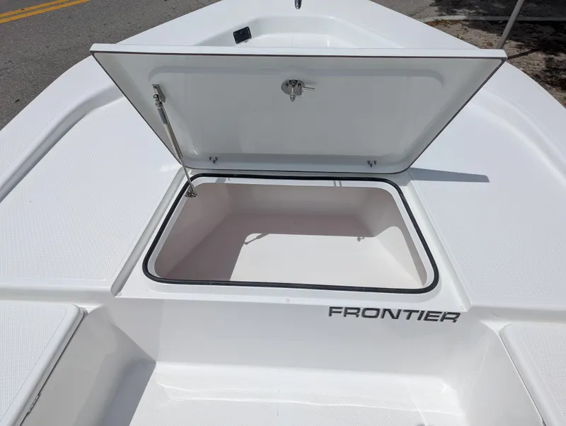 Slide: The Image of 2025 Frontier 2104 boat with open storage compartment on deck. - 11