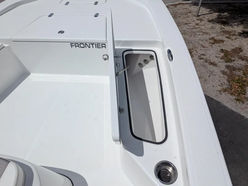 Slide: The Image of 2025 Frontier 2104 boat deck with storage compartment open. - 12