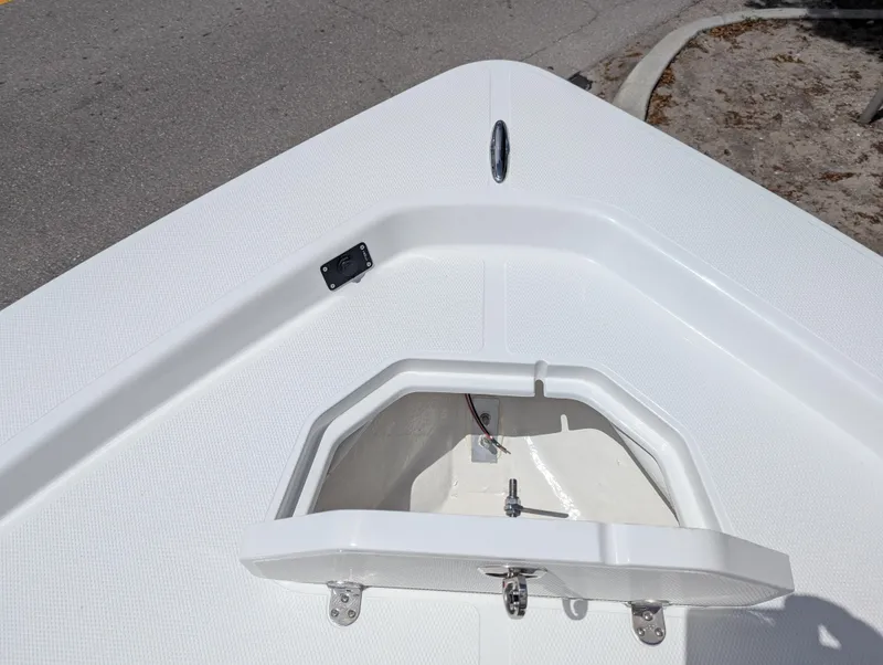 Slide: The Image of Open storage compartment on a 2025 Frontier 2104 boat deck. - 13